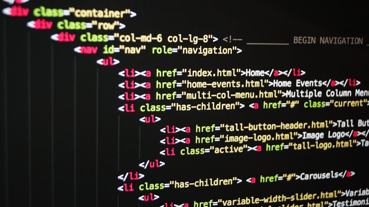 Services-02 Close-up of vibrant HTML code displayed on a computer screen, showcasing web development and programming.