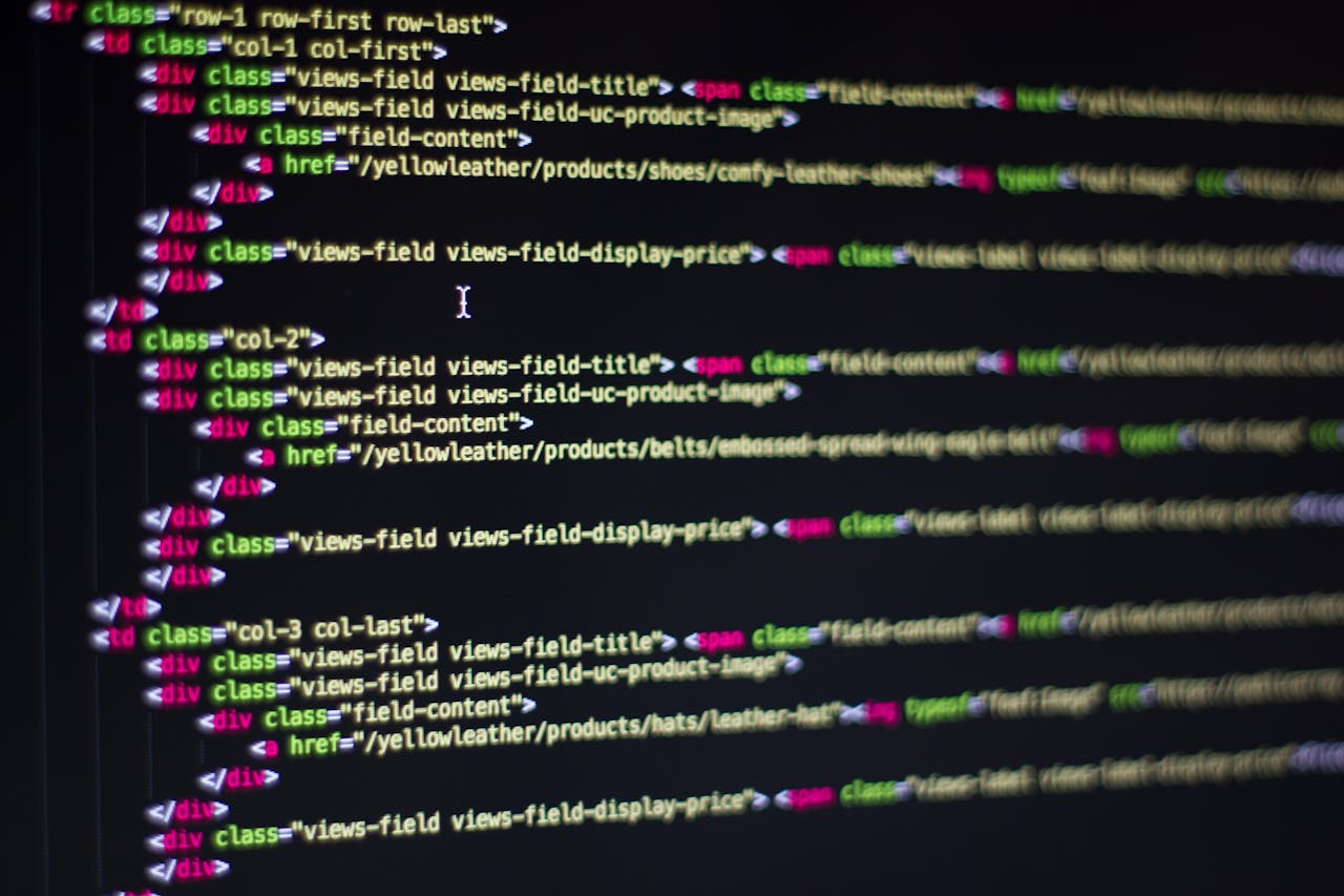 Services-01 Detailed close-up of HTML code on a computer monitor, showcasing web development.